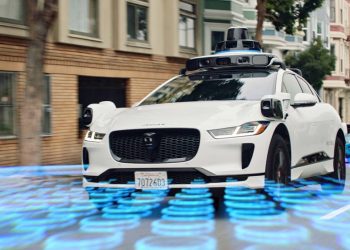 Waymo autonomous vehicle equipped with lidar sensors during robotaxi operations
